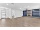 Spacious living room with hardwood floors, recessed lighting, and a modern fireplace with custom shelving at 5300 Lido St, Orlando, FL 32807
