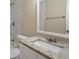 Bathroom with granite countertop and marble shower surround at 5624 Balboa Dr, Orlando, FL 32808