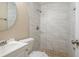 Clean bathroom with marble-tiled shower and updated fixtures at 5624 Balboa Dr, Orlando, FL 32808