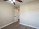 Well-lit bedroom with hardwood floors and access to hallway at 5624 Balboa Dr, Orlando, FL 32808