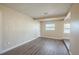 Simple bedroom with wood-look floors and neutral color palette at 5624 Balboa Dr, Orlando, FL 32808