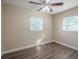 Spacious bedroom with hardwood floors and ceiling fan at 5624 Balboa Dr, Orlando, FL 32808
