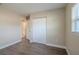 Bedroom with hardwood floors, double door closet and bathroom access at 5624 Balboa Dr, Orlando, FL 32808