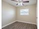 Spacious bedroom with hardwood floors and ceiling fan at 5624 Balboa Dr, Orlando, FL 32808