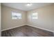Bright bedroom with hardwood floors and two windows at 5624 Balboa Dr, Orlando, FL 32808