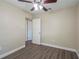 Bedroom with hardwood floors and access to another room at 5624 Balboa Dr, Orlando, FL 32808