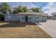 Gray house with a single-car garage and well-manicured lawn at 5624 Balboa Dr, Orlando, FL 32808