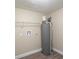 Laundry room with water heater, shelving, and hookups at 5624 Balboa Dr, Orlando, FL 32808
