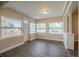 Bright living room with wood-look floors and large windows at 5624 Balboa Dr, Orlando, FL 32808