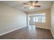 Bright living room featuring hardwood floors and a ceiling fan at 5624 Balboa Dr, Orlando, FL 32808