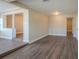 Open concept living area with wood-look floors and neutral walls at 5624 Balboa Dr, Orlando, FL 32808