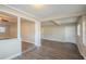 Spacious living room with wood-look floors and a neutral color scheme at 5624 Balboa Dr, Orlando, FL 32808