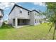 The house features a covered patio with a spacious, well-maintained backyard, ideal for outdoor enjoyment at 5680 Brosnan Rd, St Cloud, FL 34771