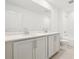 This bathroom features a double vanity, and tiled shower and floors at 5680 Brosnan Rd, St Cloud, FL 34771
