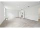 Large bedroom with neutral carpet, light walls, and an attached bathroom at 5680 Brosnan Rd, St Cloud, FL 34771
