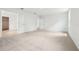 Spacious bedroom with neutral carpet, white walls and access to a walk-in closet at 5680 Brosnan Rd, St Cloud, FL 34771