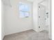This walk-in closet features plush gray carpeting, and bright natural light at 5680 Brosnan Rd, St Cloud, FL 34771