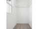 Well-lit closet with soft carpet and shelving; the perfect storage space at 5680 Brosnan Rd, St Cloud, FL 34771