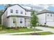 Attractive two-story home with well-kept lawn and convenient two-car garage at 5680 Brosnan Rd, St Cloud, FL 34771