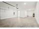Spacious garage with high ceilings, ample lighting, and concrete flooring at 5680 Brosnan Rd, St Cloud, FL 34771