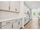 Modern kitchen featuring white cabinets, stainless steel appliances, and subway tile backsplash at 5680 Brosnan Rd, St Cloud, FL 34771