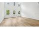 Expansive living room with high ceilings, large windows, and light hardwood floors at 5680 Brosnan Rd, St Cloud, FL 34771