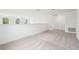 Spacious loft area with neutral carpet and multiple windows bringing in natural light at 5680 Brosnan Rd, St Cloud, FL 34771