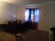 Bedroom with a double bed and patterned curtains at 7628 Forest City Rd # 056 Aka H, Orlando, FL 32810