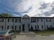 Front view of a two-story building with stairs and parking at 7628 Forest City Rd # 056 Aka H, Orlando, FL 32810
