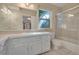 Bathroom with shower/tub combo, double vanity and tile floor at 816 Laurel Ave # 1, Orlando, FL 32803