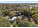 Two-story home with city skyline view; lush trees surround at 817 Antonette Ave, Winter Park, FL 32789