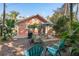 Backyard patio with seating area and tropical landscaping at 817 Antonette Ave, Winter Park, FL 32789