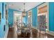 Blue walls and dark hardwood floors in this elegant dining room at 817 Antonette Ave, Winter Park, FL 32789