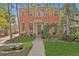 Charming two-story coral home with landscaped front yard and brick pathway at 817 Antonette Ave, Winter Park, FL 32789