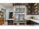 High-end stainless steel range and hood in a dark wood kitchen at 817 Antonette Ave, Winter Park, FL 32789