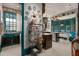 Charming kitchen with teal cabinetry, a decorative plate display, and a mix of old and new appliances at 817 Antonette Ave, Winter Park, FL 32789