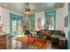 Spacious living room with unique ceiling, fireplace and access to backyard at 817 Antonette Ave, Winter Park, FL 32789