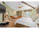 Large main bedroom with a king-size bed and leather couch at 817 Antonette Ave, Winter Park, FL 32789