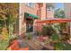 Relaxing patio with brick pathway, umbrella, and lush landscaping at 817 Antonette Ave, Winter Park, FL 32789