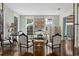 Bright sitting room with French chairs and a cowhide rug at 817 Antonette Ave, Winter Park, FL 32789