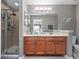 Double vanity bathroom with a large shower at 890 Assembly Ct, Reunion, FL 34747