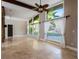 Spacious living area with tile flooring, large windows, and a ceiling fan at 960 Seminole Ave, Altamonte Springs, FL 32701