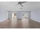 Spacious living room featuring light walls and wood-look floors at 10107 Musket Ln, Orlando, FL 32821