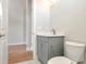 Modern bathroom with gray vanity and marble floor at 1045 Liliana Dr, Deland, FL 32724