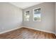 Bright bedroom featuring wood-look floors and large windows at 1045 Liliana Dr, Deland, FL 32724