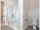 Bathroom featuring a walk-in shower, toilet, and built-in shower seat at 1062 Liliana Dr, Deland, FL 32724
