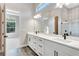 Spa-like bathroom with double vanity and large mirror at 1062 Liliana Dr, Deland, FL 32724