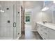 Double vanity bathroom with a walk-in shower at 1062 Liliana Dr, Deland, FL 32724