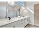 Double vanity bathroom with a large mirror and shower at 1062 Liliana Dr, Deland, FL 32724