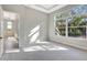 Bright bedroom with large windows and plush carpeting at 1062 Liliana Dr, Deland, FL 32724